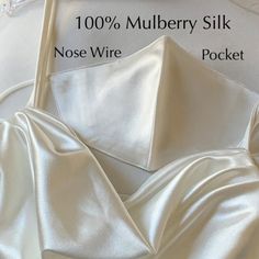 "3 Layers of highest quality SILK with quality sewing stitch work offered at the lowest price. This is not cheap 2 layer low grade mulberry silk with poor sewing stitch! Every Layer of this mask is 100% mulberry Silk Grade 6A 19mm. FACTS TO KNOW about your Silk or Satin Mask - Are you buying a silk or satin mask? Silk is far superior to satin in quality and benefits. Our Mask is 100% Mulberry Silk. All 3 layers of our mask are made with Mulberry Silk. - SENSITIVE SKIN and ALLERGIES ? Our Mulberr Thank You Wishes, Silk Mask, Silk Face Mask, Mulberry Silk Fabric, Stitch Work, Sewing Stitches, Wish You The Best, White Silk, 3 Layers