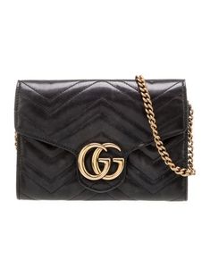 Gucci Crossbody BagBlack LeatherDouble G LogoGold-Tone HardwareChain-Link Shoulder StrapChain-Link AccentsLeather Lining & Three Interior Pockets with Card SlotsSnap Closure at FrontUnfortunately, due to restrictions, this item may not be eligible for shipping in all areas. Gucci Crossbody, Gucci Monogram, Cross Body Handbags, Women Handbags, Monogram, Gucci, Handbags, Black