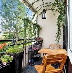 an outdoor patio with wooden chairs and tables