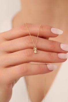 "14K Solid Gold Tiny Cat Necklace / Dainty Cat Jewelry / Cat Lover Gift / Cat Pendant / Cute Kitty Necklace /Cat Memorial Gift / Gift For Her / Cat Charm Necklace / Cat Lovers Gift /  Valentines Day Gift / Minimalist Handmade Necklace * Gold KT: 14K Solid Gold * Gold Color: Gold, Rose Gold, White Gold * Available Inches: 14\", 15\", 16\", 18\", 20\", 22\", 24\". Follow on Instagram - @bayargold.tr My Web Site - https://www.bayargold.com/ * Bayar Gold is a fine jewelry company. Please do not hesitate to ask us questions. We are always here to help you. * All items are packed in the high-quality jewelry box. The gift message is available. Please let us know what to write by leaving us a note at checkout.  * Gift wrapping available.  Express shipping * United States: 4-6 business days * Canad Cute Gold Necklace With Cat Design, Cat Necklace Gold, Cat Charm Necklace, Kitty Necklace, Cat Memorial Gift, Accessories Necklaces, Necklace Cat, Cat Pendant Necklace, Tiny Cats