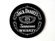 jack daniels'old no 7 tennessee whiskey round tin with black lid and white lettering