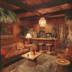 a living room filled with furniture and plants