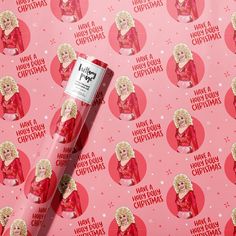 a pink wrapping paper with an image of santa claus on it and the words happy holidays