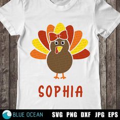 a white shirt with an image of a turkey wearing a bow on it's head