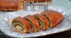 an old fashioned nut rolls cut in half on a plate with the words, old fashioned nut rolls