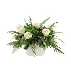 a white vase filled with flowers and greenery