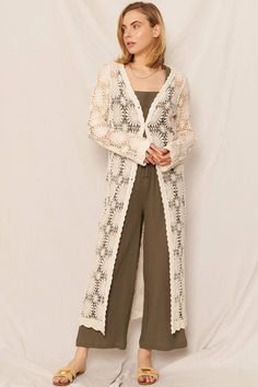 Look blooming beautiful in our Flower Pattern Crochet Kimono Cardigan! This maxi kimono boasts a delicate, floral pattern and is hand-crocheted for a unique touch. Perfect for adding a pop of style to any outfit. (Flower power never looked so good!) 100% Cotton Long Spring Cardigan For Vacation, White Bohemian Long Outerwear, Long Cream Spring Kimono, Long White Cardigan For The Beach, White Long Cardigan For The Beach, Long Cardigan For Beach In Spring, Elegant Beach Cardigan For Spring, Bohemian Beige Floral Print Outerwear, Elegant White Beach Cardigan