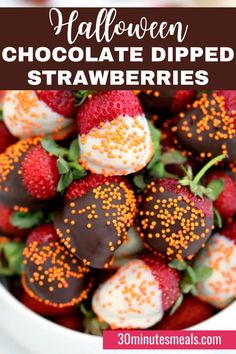 chocolate dipped strawberries in a white bowl with sprinkles on the top