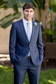 a man in a suit and tie is posing for a photo on his facebook page