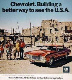 a group of people standing next to a car in front of an adobe - style building