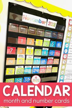 a calendar with the words, month and number cards on it in front of a bulletin board