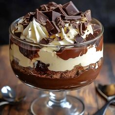 a dessert with chocolate and cream in a glass dish