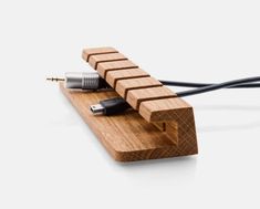 an electronic device is connected to a wooden block