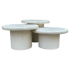 three white pedestals sitting on top of each other