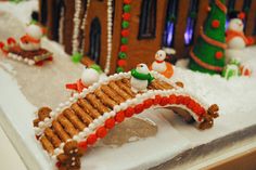 a gingerbread house is decorated with christmas decorations