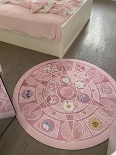 a bedroom with a bed, mirror and pink rug on the floor in front of it