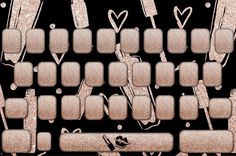 a computer keyboard with lots of hearts and arrows on the backgroung surface