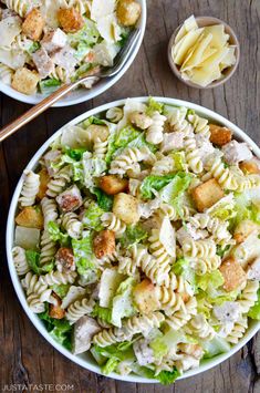 two bowls filled with pasta salad and dressing