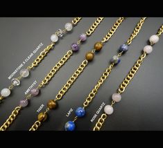 Elevate your sunglasses/eyeglasses look with a unique brass chain embellished with a variety of beads and gemstones including amethyst, rose quartz, moonstone, clear quartz, lava, lapiz, tiger, and more. Our luxurious chains can function as a sunglasses chain, eyeglasses chain, mask chain, necklace, or body chain. CHAIN FEATURES: - A variety of beads and gemstones (15 to 20 beads per chain) with two lobster clasps and rubber bands / elastics to connect to the glasses. - A beautiful brass chain in gold color (the chain is not polished so it would become more antique/vintage looking over time). - Can be used for your sunglasses, eyeglasses, as necklace, body chain, or to hold your mask.  - A velvet pouch for storage CHAIN DETAILS: - All chains are 30 inches in length - All chains are made of Handmade Metal Glasses Chains As Gift, Metal Glasses Chains As Gift, Beaded Metal Glasses Chains As Gift, Metal Beaded Glasses Chains As Gift, Metal Beaded Glasses Chains For Gifts, Metal Glasses Chain With Adjustable Chain As Gift, Elegant Handmade Metal Glasses Chains, Bohemian Gold Beaded Glasses Chains, Elegant Metal Glasses Chain With Adjustable Chain