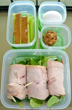 three plastic containers filled with different types of food