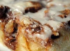 a close up of a cinnamon roll with icing