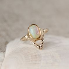 Elegant opal ring featuring a V-shaped design adorned with sparkling diamond accents Custom Ring Designs, Gold Branding, Necklace Box, Alternative Engagement Rings, Custom Earrings, Unique Diamonds, 14k Gold Ring, Engagement Ring Styles, Opal Rings