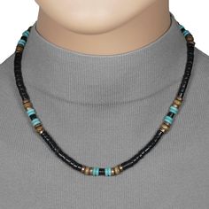 This fashionable handmade necklace is made with black coco shell heishi beads along with turquoise, copper and wood accent beads.  It is available in your choice of 16, 18, 20 or 24 inches long.  It is sure to compliment many outfits.  This necklace would be perfect for both men and women.  It is strung on strong and flexible Accuflex wire and is finished with a lobster claw clasp. The finished length may vary +/- 1/4 inch. Please view the 18 inch model shot for size reference on an adult female Black Beaded Necklaces With Spacer Beads For Beach, Black Beaded Necklaces For Beach, Black Heishi Beads For Beach, Handmade Southwestern Black Beaded Necklace, Black Heishi Beads Jewelry, Handmade Black Heishi Beads, Black Wooden Beads For Beach, Black Heishi Beads Necklace For Gift, Handmade Southwestern Black Beads