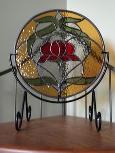 a close up of a stained glass window on a railing