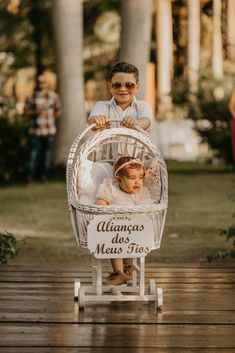 a baby in a white stroller with the words'albancas do mess free'written on it