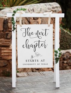 a sign that says the next chapel starts at university of texas in front of a stone wall