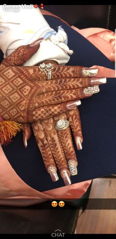 hendi tattoos on the hands of a woman