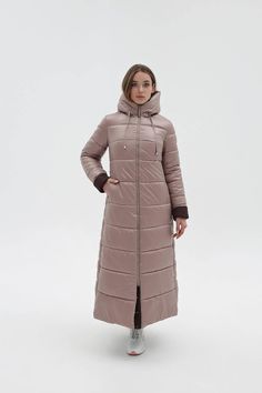 Maxi Quilted Hooded Coat Waterproof and Windproof Long Jacket This women's winter puffer coat is made from raincoat fabric and features a semi-fitted silhouette with set-in sleeves. The attached hood adds extra warmth and protection. Outer Fabric: Raincoat fabric, insulated with silicone Lining: Raincoat fabric Decorative Details: Seams, stitching, zipper trim, and patches Pockets: Hidden zipper pockets in the front seams Closure: Zipper and snap buttons Sleeve Length: 65 cm with a cuff, or 72 cm without Back Length: 131 cm Fabric Composition: 100% Polyester Solid Color Weatherproof Parka For Winter, Weatherproof Solid Color Parka For Winter, Weatherproof Parka For Winter, Winter Waterproof Outerwear, Hooded Waterproof Parka For Winter, Hooded Waterproof Winter Parka, Weatherproof Hooded Outerwear For Cold Weather, Weatherproof Hooded Parka For Winter, Beige Puffer Jacket With Detachable Hood For Outdoor