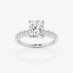 a diamond engagement ring on a white background