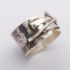 This "Koji" silver ring is handmade in 925 Sterling Silver in my workshop. The ring is hand crafted using a 92.5% pure silver flat piece, bent to shape, soldered, hammered and oxidized to give that special finish.The finish of this ring is inspired by the "Mokume-gane" distinctive pattern found on japanese swords.Materials: 92.5% pure solid silverBand width: 1/2 inch (1.3 cm)Ring size: 9 (This is a unique creation. Because of the special finish, it cannot be reproduced or resized. Only one size Artisan Sterling Silver Wide Band Ring, Hand Cast Sterling Silver Wide Band Jewelry, Wax Tutorial, Japanese Swords, Mens Silver Jewelry, Mokume Gane, Silver Flats, Men Jewelry, Mens Silver Rings