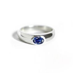 "14k Solid White Gold Oval Sapphire Engagement Ring Minimalist Fine Blue Sapphire Gold Ring Wedding Anniversary Gift For Her Daily Wear * Made To Order Ring Size: All Size Available Metal : 14K Solid White Gold (Stamped) / Option available in 18K Gemstone: Blue Sapphire * Blue Sapphire Weight : 0.40 ct * Gemstone Shape : Oval * This ring is 5.5 mm wide at the top and 3.5 mm wide at the base * Rings also available in other gemstone for enquire please contact with us ★ All our products come packag Classic Oval Sapphire Ring With Polished Finish, Modern Oval Engraved Ring With Polished Finish, Modern Engraved Oval Ring With Polished Finish, Modern Oval Sterling Silver Signet Ring, Oval Cabochon Signet Ring With Polished Finish, Elegant Oval Sapphire Signet Ring, Modern Sterling Silver Birthstone Ring For Wedding, Classic Oval Cabochon Sapphire Ring For Anniversary, Oval Sapphire Ring In 14k Gold With Polished Finish