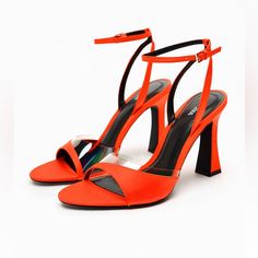 Brand New. Satin Effect Sandals. Front Vinyl Detail. Rounded Toe. Buckled Ankle Strap Closure Heel Height 3.7” Elegant Orange Sandals For Summer, Orange Block Heel Sandals For Evening, Elegant Orange Open Toe Sandals, Orange Formal Heels For Summer, Elegant Orange Sandals With Padded Heel, Orange Open Toe Evening Sandals, Orange Evening Sandals For Summer, Formal Orange Ankle Strap Sandals, Orange Pointed Toe Sandals For Summer