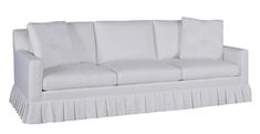 a white couch with pleated skirting on the bottom and back ends, sitting in front of a white background