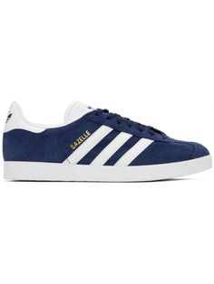 adidas Originals 
Navy Gazelle Sneakers 
Low-top nubuck sneakers in navy. 
. Lace-up closure 
. Logo embossed at tongue 
. Padded collar 
. Signature serrated stripes at sides 
. Logo printed at outer side and heel tab 
. Padded OrthoLite® footbed 
. Faux-leather and mesh lining 
. Treaded rubber sole 
. Incudes additional laces in white 
Supplier color: Collegiate navy/White/Gold metallic 
Upper: leather, synthetic. Sole: rubber. 
Made in Indonesia. 
242751M237011 
Originals Navy Gazelle Sneake Navy Blue Gazelle Adidas Outfit, Suede Low-top Sneakers With Three Stripes, Three Stripes Lace-up Skate Shoes, Navy Gazelle, Navy Adidas Sneakers For Sports, Navy Lace-up Sporty Skate Shoes, Sporty Navy Lace-up Skate Shoes, Low-top Suede Sneakers With Three Stripes, Navy Blue Adidas Gazelle