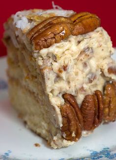 a piece of cake with pecans on top