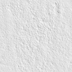 a white wall that has some kind of textured paint on it's surface