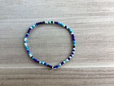 Blue and black glass bead bracelet Casual Blue Beaded Bracelet With Faceted Beads, Casual Blue Faceted Beaded Bracelets, Casual Blue Faceted Beads Bracelet, Casual Blue Beaded Bracelets With Spacer Beads, Casual Blue Bracelets With Faceted Beads, Casual Blue Bracelet With Faceted Beads, Blue Jewelry With Black Beads For Beach, Blue Beaded Bracelets With Black Beads For Beach, Casual Blue Bracelets With Spacer Beads