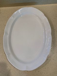 a white plate sitting on top of a counter