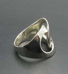 Sterling silver ring 925/1000. Stamped 925. Approximate weight 7.0 grams. Top width 2.0cm All our jewels are made from solid sterling silver 925/1000 and are carefully crafted by hand in our family workshop. We dispatch your orders in 5 working days, worldwide and the postage is $5. We ship registered priority mail. Please allow 5-7 working days for delivery in Europe and 10-15 working days outside Europe. For any questions - please do not hesitate to contact me! Sterling Silver Open Ring For Formal Occasions, Modernist White Gold Signet Ring In Sterling Silver, Modernist Open Band Jewelry With Polished Finish, Modernist White Gold Sterling Silver Signet Ring, Modernist Open Band Rings For Formal Occasions, Polished Sterling Silver Rings, Minimalist Sterling Silver Wide Band Ring For Formal Events, Minimalist Sterling Silver Wide Band Ring For Formal Occasions, Modern Wide Band Sterling Silver Signet Ring