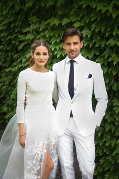 a man and woman in wedding attire posing for a photo on their wedding day with the caption popsugar