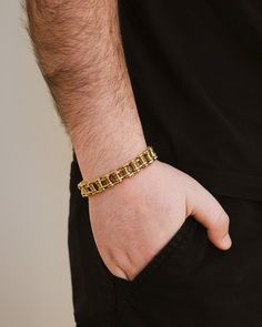 Upgrade your wrist game with our exclusive Bolt Chain Watch Band Bracelet. This sophisticated men's bracelet features a watch band chain that adds a touch of luxury and style to your outfit. Elevate your look with the perfect balance of elegance and functionality. Materials: 14K gold plated stainless steel, rhodium plated stainless steel, ion plated stainless steel Features: Measures 7" length, 0.45" width, Lead & Nickel free, foldover single channel clasp Stainless Steel Gold Jubilee Chain Link Bracelet, Gold Stainless Steel Jubilee Chain Link Bracelet, Gold Alloy Watch For Gift, Cuban Link Box Chain Bracelet For Formal, Metal Box Chain Link Bracelet, Gold Cuban Link Bracelet With Metal Strap, Stainless Steel Jubilee Chain Link Bracelet, Formal Stainless Steel Cuban Link Bracelet, Formal Metal Chain Bracelet With Adjustable Chain