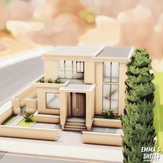 a model of a house with trees and bushes