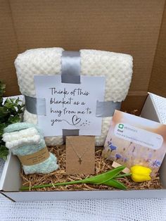 a gift box filled with items for someone's special day or baby shower party