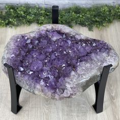 "Extra Quality Brazilian Amethyst coffee table on a black metal stand. This remarkable gemstone has nicely shaped amethyst points with beautiful violet colors. Truly amazing! This geode's polished edges and natural outer shell add a lot of character to this piece. Its shape reminds us of a traditional diamond shape and it will accent any room, be that your living room or office. Glass top NOT included so you can add the shape and size of glass you prefer. The size of the sample glass pictured is Pallet Crates, Amethyst Cathedral, Agate Coasters, Traditional Diamond, Amethyst Point, Glass Pictures, Metal Stand, Unique Gemstones, Coffee And End Tables