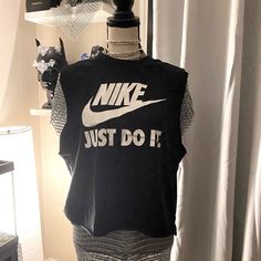 Open Cut. Nike Black T-shirt For Spring, Trendy Stretch Nike Tops, Trendy Nike Stretch Tops, Nike Black Sleeveless Top, Nike Black Summer T-shirt, Black Nike Cotton Top, Nike Black Cotton Tops, Black Cotton Nike Tops, Nike Fitted Graphic Print Top