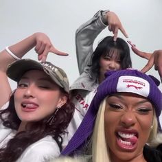 three women wearing hats and posing for the camera